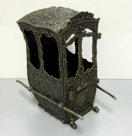 Appraisal: DUTCH SILVER MINIATURE SEDAN CHAIR Typical form with hinged front