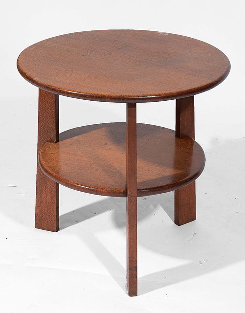 Appraisal: A Cotswold style oak circular occasional tableof two tier form