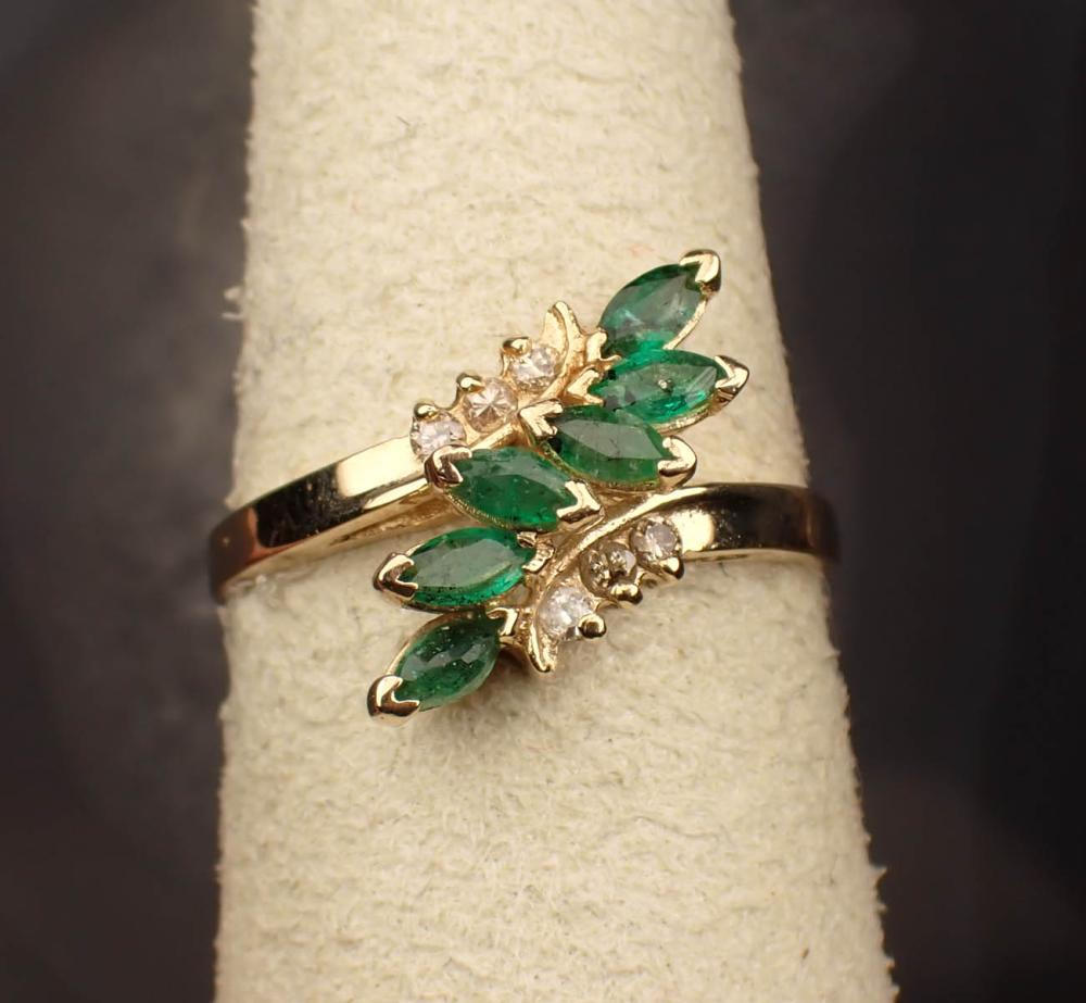 Appraisal: EMERALD DIAMOND AND FOURTEEN KARAT GOLD RING The yellow gold