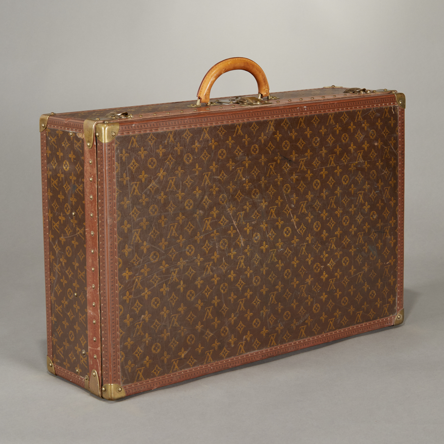 Appraisal: VINTAGE LOUIS VUITTON HARD-SIDED SUITCASE Mid- th c France Louis