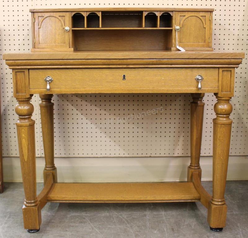 Appraisal: An antique golden oak lady's writing desk with two doors