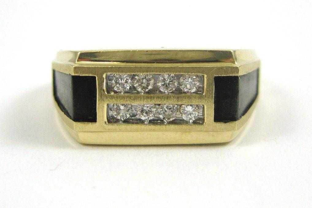 Appraisal: MAN'S DIAMOND AND FOURTEEN KARAT GOLD RING with two sections