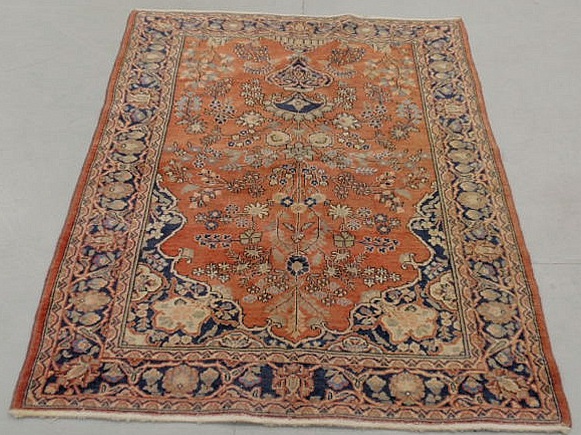 Appraisal: Sarouk center hall oriental carpet red field overall floral patterns