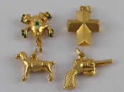 Appraisal: A mixed lot comprising four yellow metal charms all marked