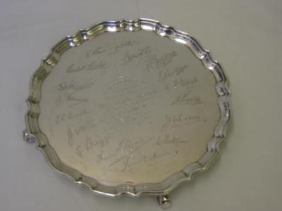 Appraisal: A PRESENTATION WAITER with moulded Chippendale rim chased inscription surrounded