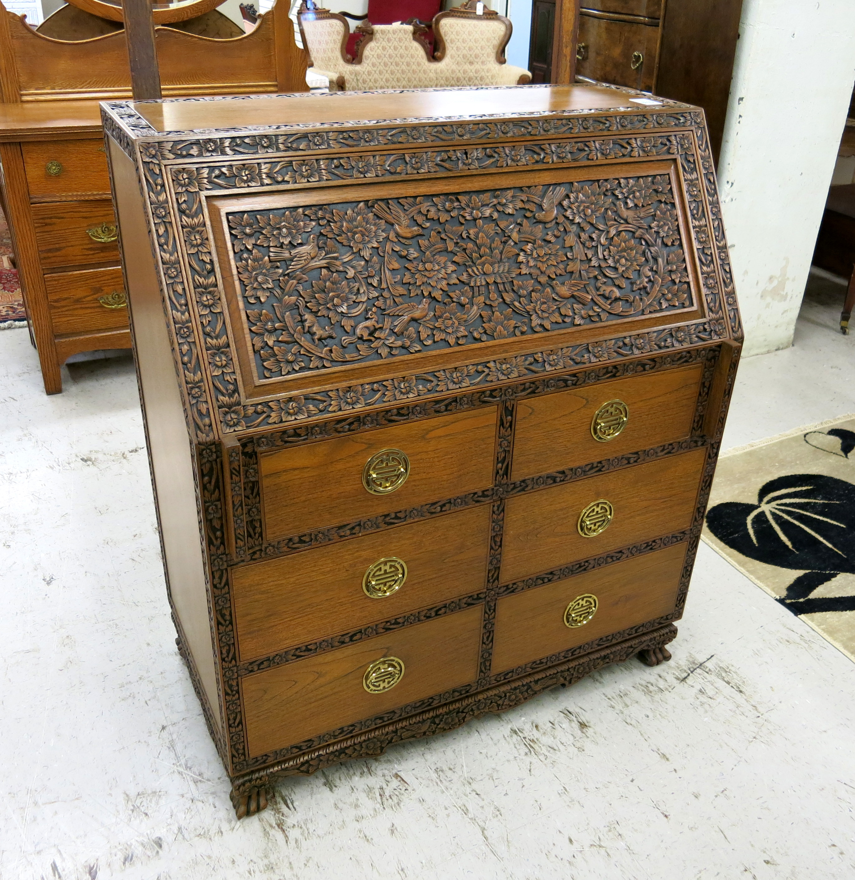 Appraisal: CARVED TEAKWOOD SLANT-FRONT SECRETARY Thailand th century the carved slant