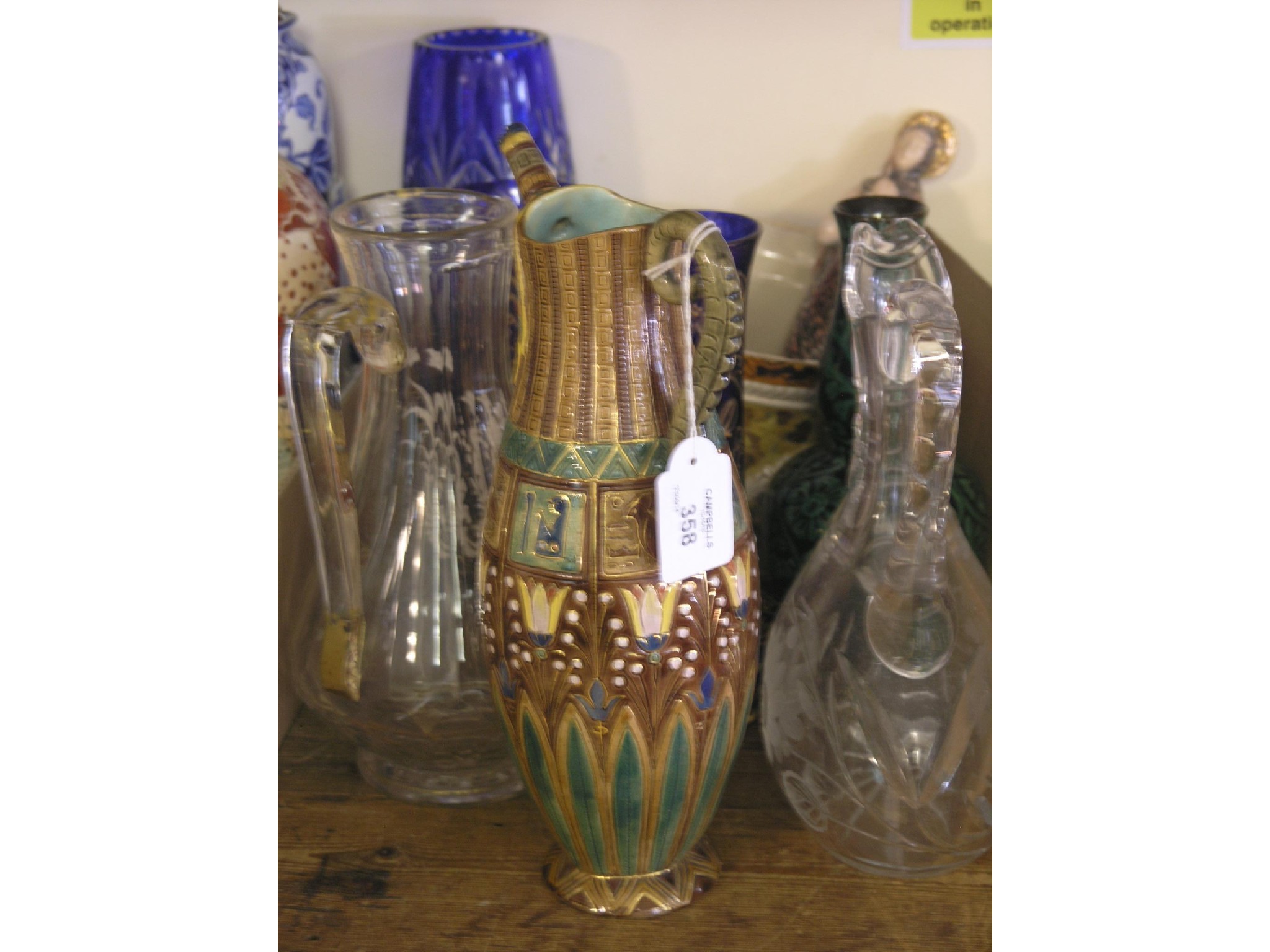 Appraisal: A majolica jug moulded in Egyptian-style in - chips and