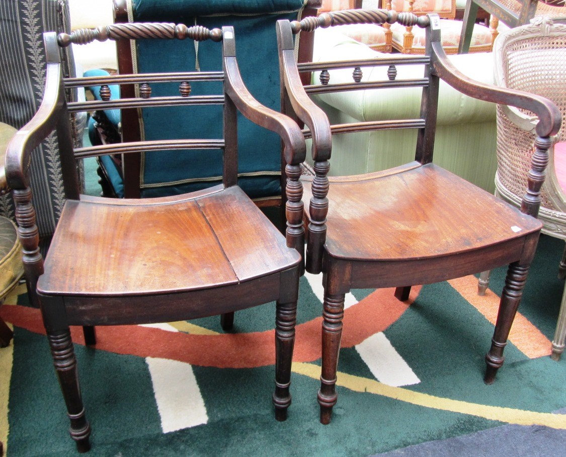 Appraisal: A pair of th century mahogany framed open armchairs with