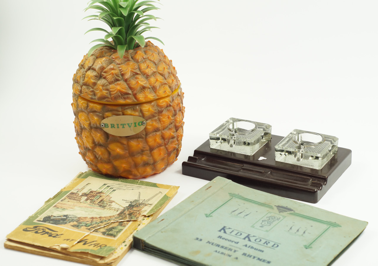 Appraisal: A Britvic plastic pineapple ice bucket brown Bakelite desk stand