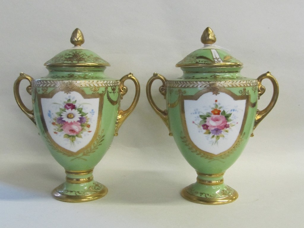 Appraisal: Pair of Noritake two handled urns and covers the green