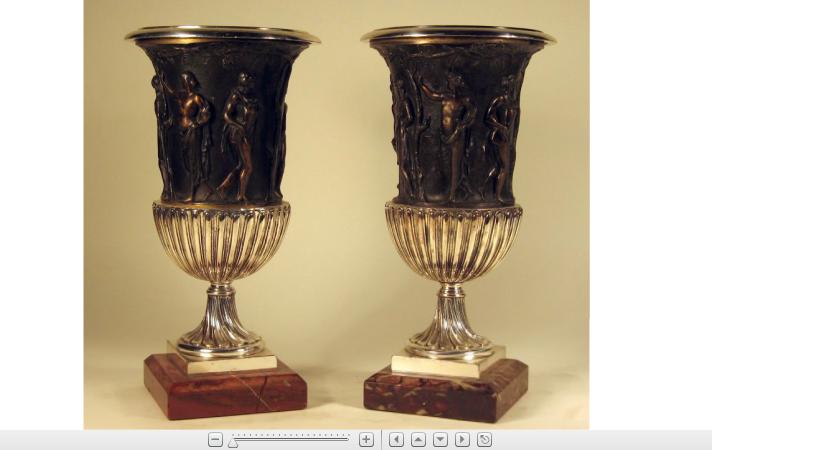 Appraisal: Pair of Neoclassical style silvered and patinated metal urnsOf campagna