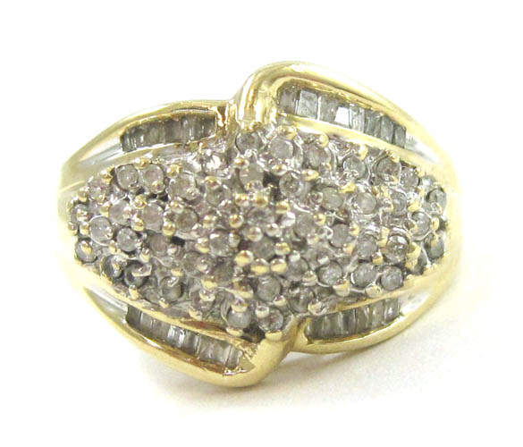 Appraisal: DIAMOND AND FOURTEEN KARAT GOLD CLUSTER RING with baguette diamonds