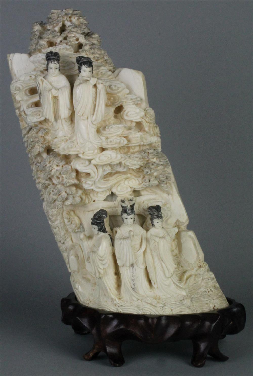 Appraisal: CHINESE IVORY CARVING OF GODDESSES the gently curving section deeply