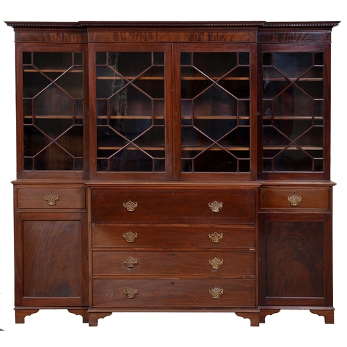 Appraisal: An Edwardian mahogany breakfront secretaire-bookcase with dentil cornice and fitted