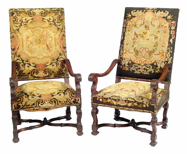 Appraisal: A pair of Louis XIV carved walnut armchairs wear to