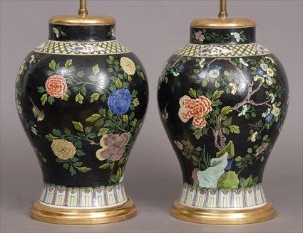 Appraisal: PAIR OF FAMILLE VERTE BLACK-GROUND JARS MOUNTED AS LAMPS Of