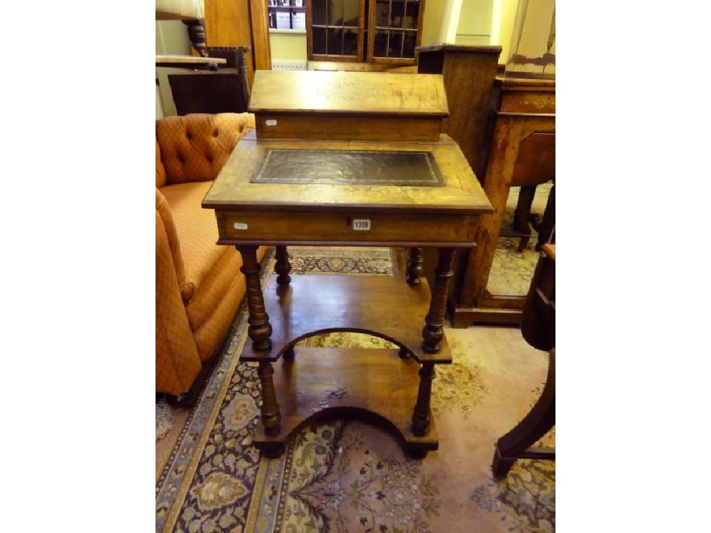 Appraisal: A Victorian walnut Davenport with inlaid boxwood stringing and floral