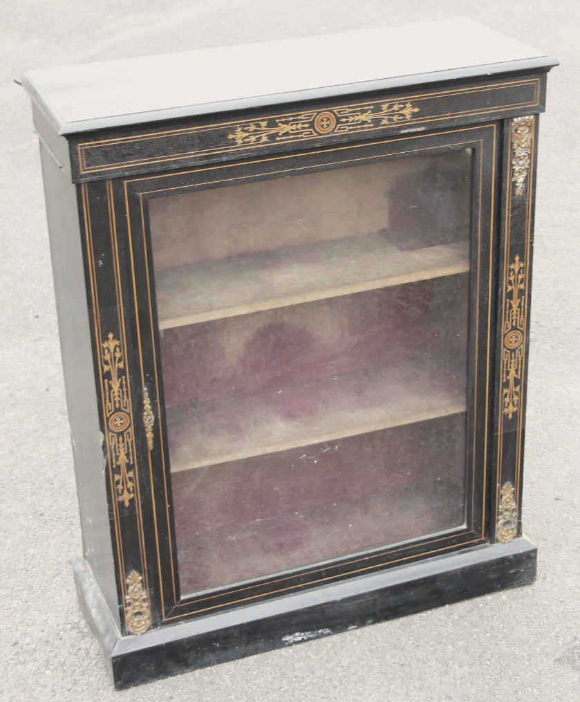 Appraisal: A thC ebonised pedestal pier cabinet the rectangular overhanging top