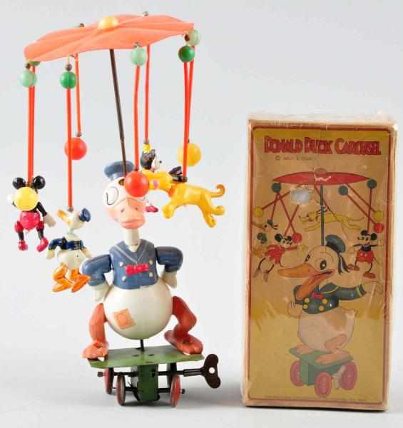 Appraisal: Celluloid Disney Donald Duck Carousel Wind-Up Toy Description Japanese Pre-war