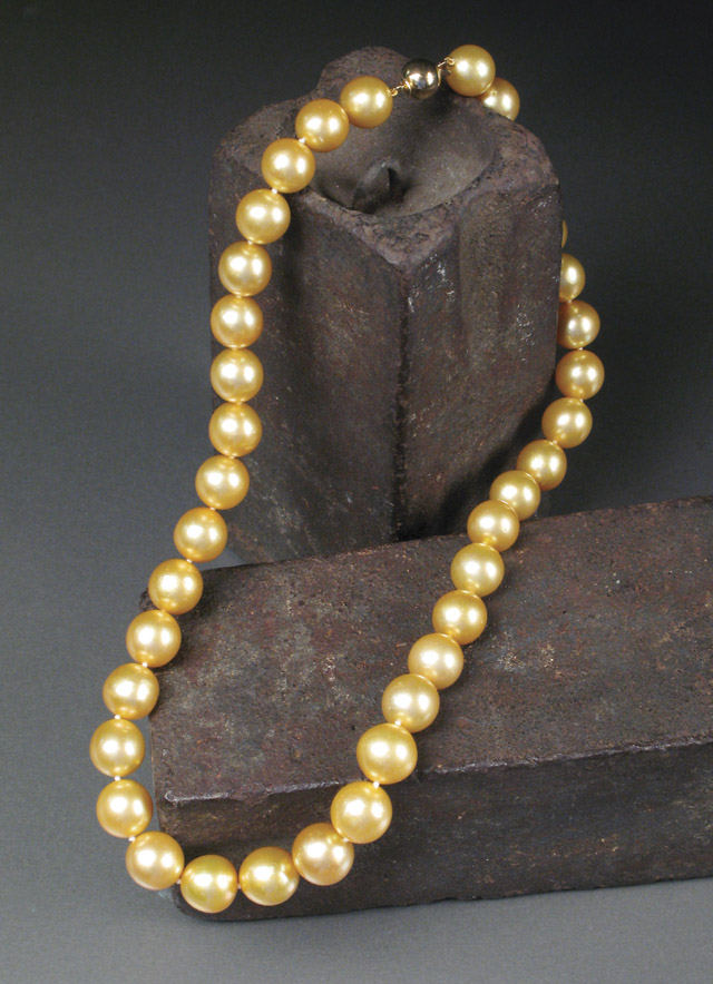 Appraisal: GOLDEN SOUTH SEA PEARL NECKLACE strung with round round graduated