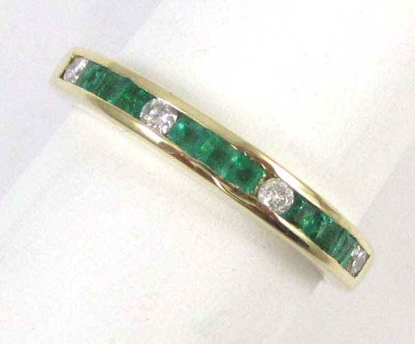 Appraisal: EMERALD DIAMOND AND FOURTEEN KARAT GOLD RING set with four