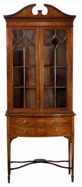 Appraisal: An Edwardian mahogany and inlaid cabinet the shaped pediment with