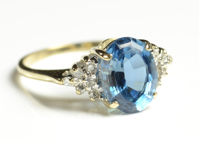 Appraisal: BLUE TOPAZ DIAMOND AND FOURTEEN KARAT GOLD RING with six