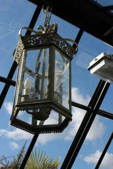 Appraisal: A GREEN PAINTED HEXAGONAL HALL LANTERN with pierced decoration and