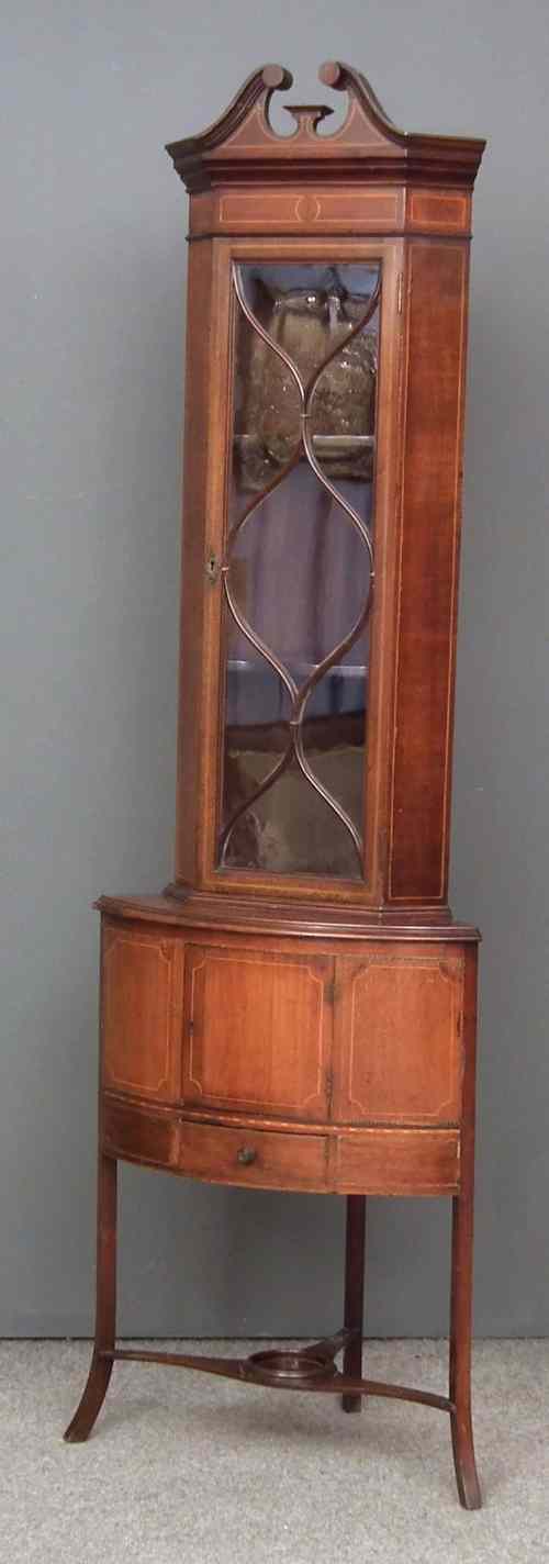 Appraisal: An Edwardian inlaid mahogany corner cupboard inlaid with boxwood stringings