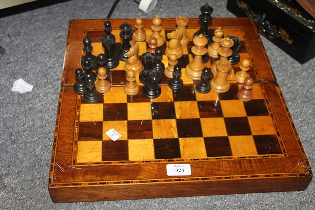 Appraisal: A VICTORIAN MAHOGANY INLAID FOLDING BACKGAMMON AND CHEQUER BOARD GAMES