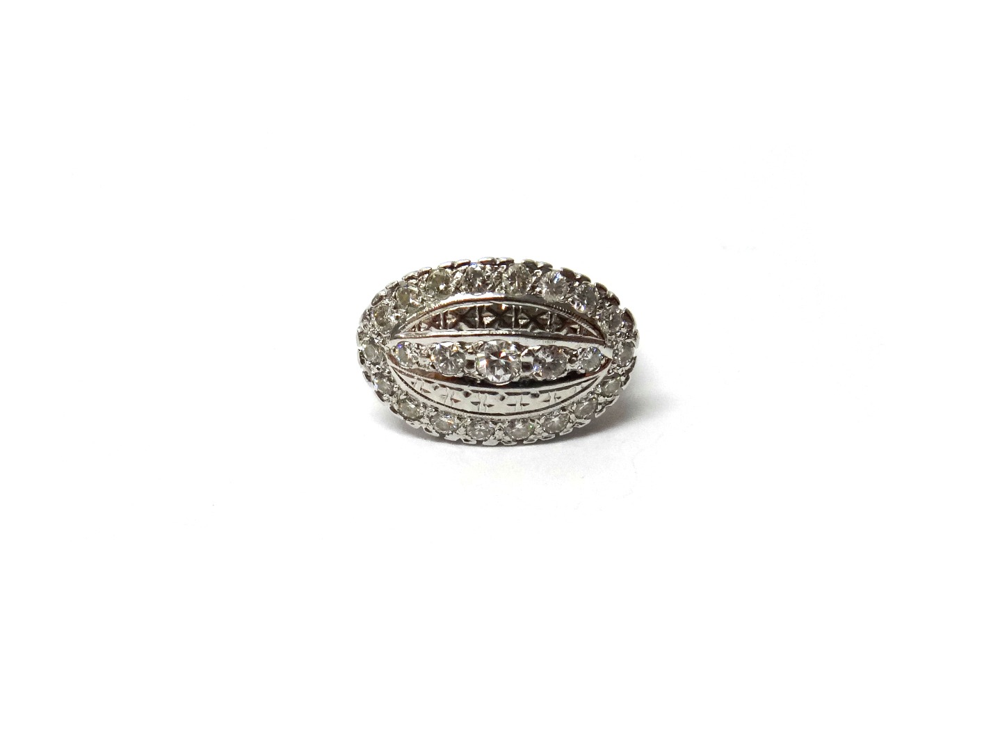 Appraisal: A white gold and diamond set ring in an oval