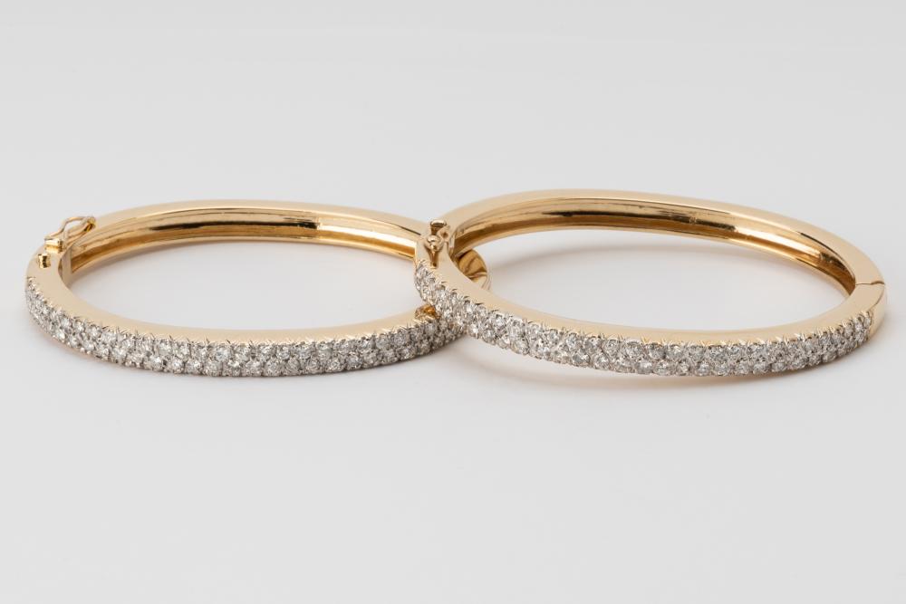 Appraisal: PAIR OF KARAT YELLOW GOLD DIAMOND BANGLESIncluding a karat yellow