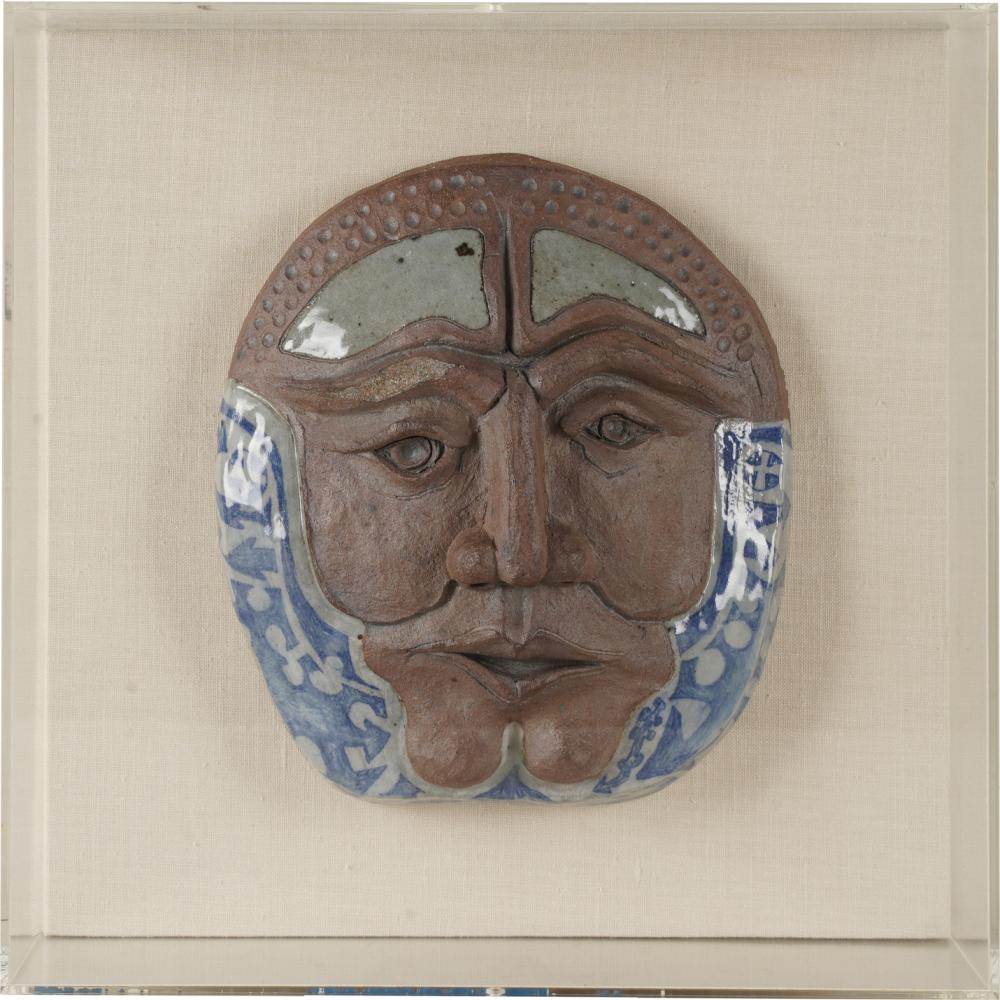 Appraisal: GLAZED CLAY MASKglazed and unglazed pottery mounted on a fabric