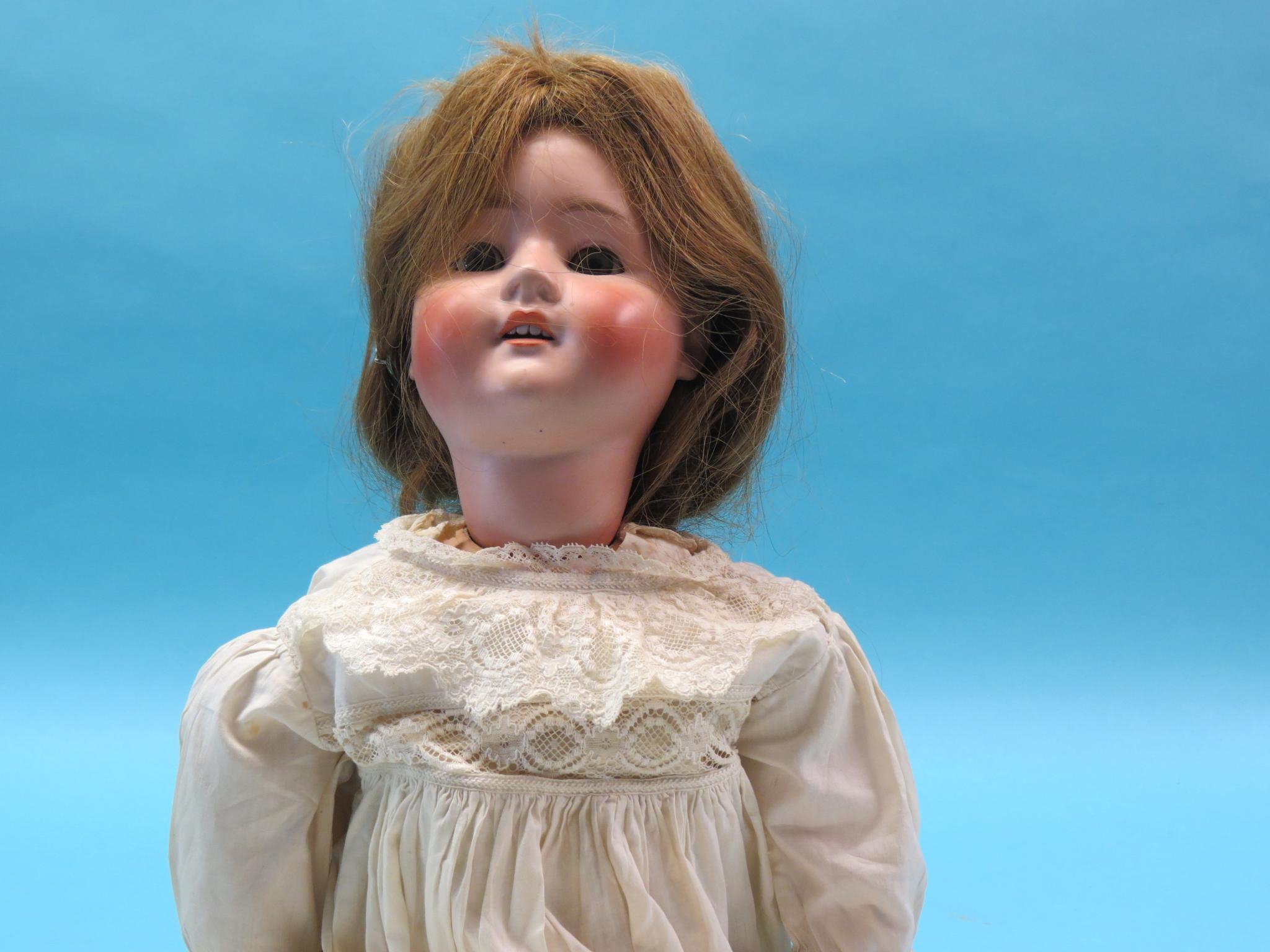 Appraisal: A large bisque doll Schoenau Hoffmeister mould with sleeping eyes