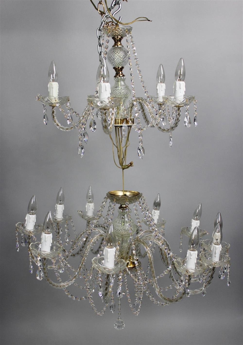 Appraisal: DOUBLE TIER GLASS AND BRASS CHANDELIER the candleholders on upcurved