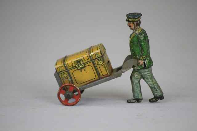 Appraisal: BELL HOP WITH LUGGAGE PENNY TOY Germany lithographed and marked