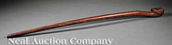 Appraisal: An American Walnut Walking Stick th c handle in the