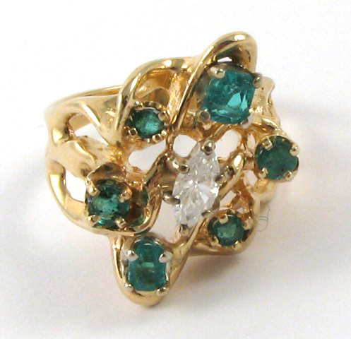 Appraisal: EMERALD AND DIAMOND RING k yellow gold centering a marquise-cut