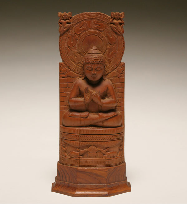 Appraisal: Sarnath carved wooden Buddha in teaching pose with ornate mandorla