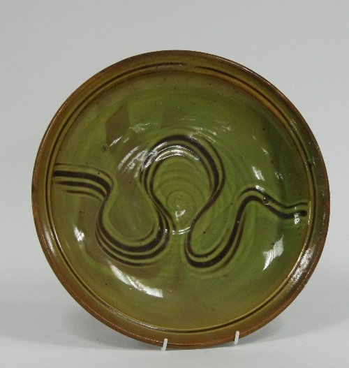 Appraisal: Ray Finch Winchcombe Pottery A slipware dish with combed decoration