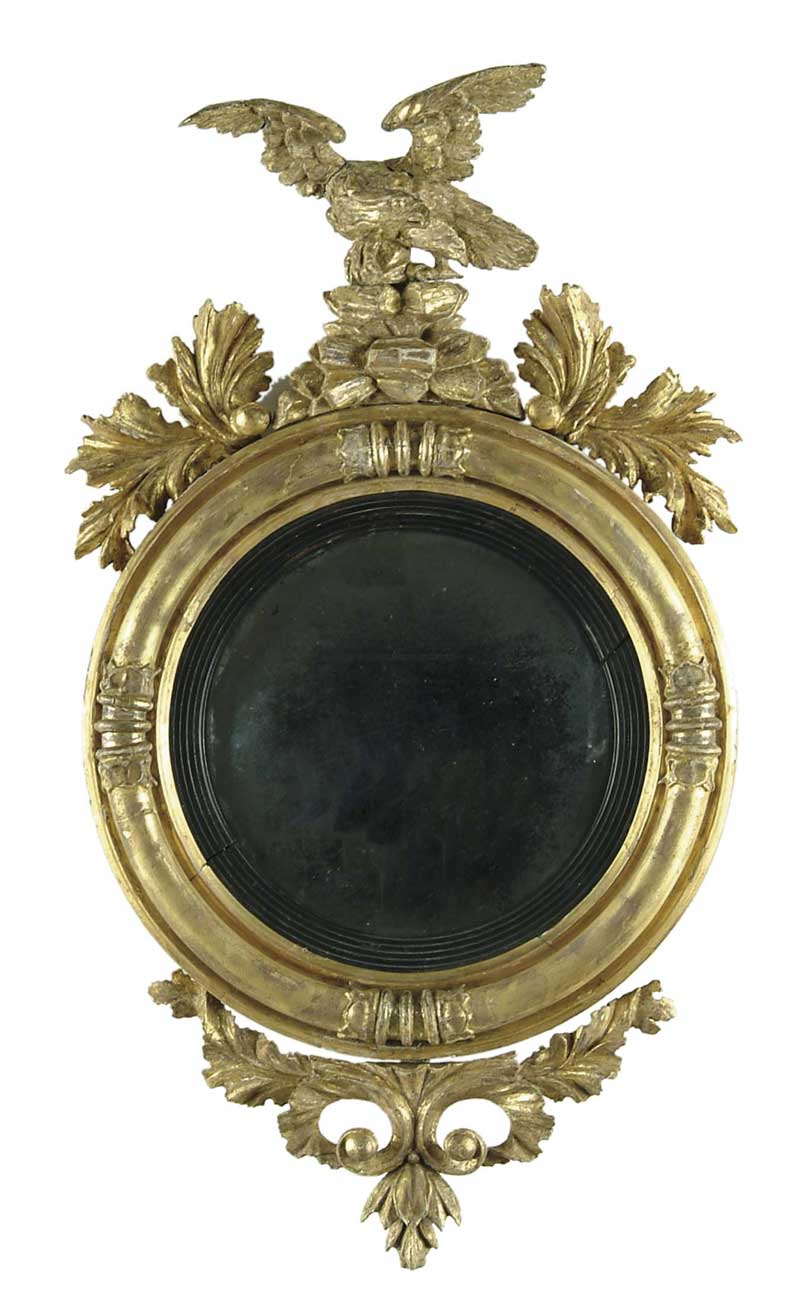 Appraisal: FINE GILT CONVEX MIRROR WITH EAGLE Round frame surmounted by