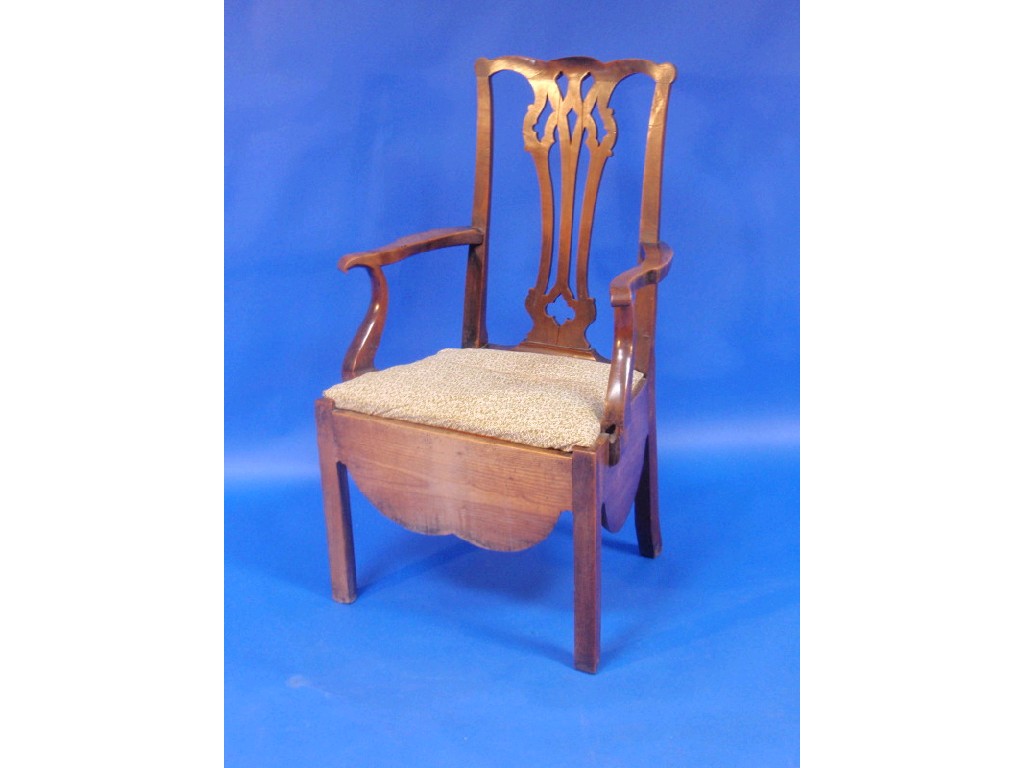 Appraisal: A Georgian fruit wood commode chair with pierced vase splat