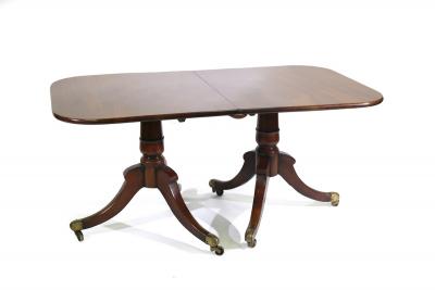 Appraisal: A Regency style mahogany twin pedestal dining table with an