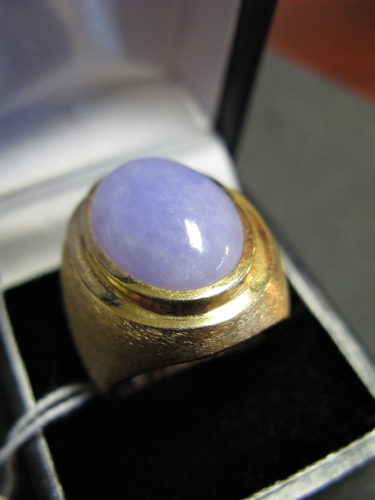 Appraisal: LAVENDER JADE AND FOURTEEN KARAT GOLD SOLITAIRE RING WITH APPRAISAL