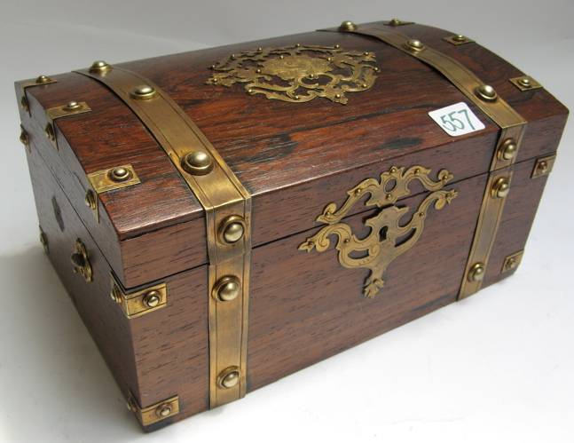 Appraisal: A MAHOGANY JEWELRY OR TREASURE BOX having brass bands and