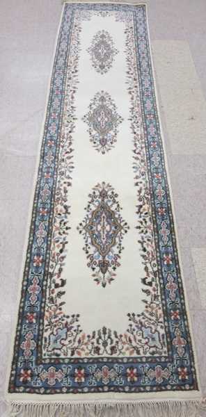 Appraisal: HAND KNOTTED ORIENTAL RUNNER Indo-Kerman featuring three floral medallions on