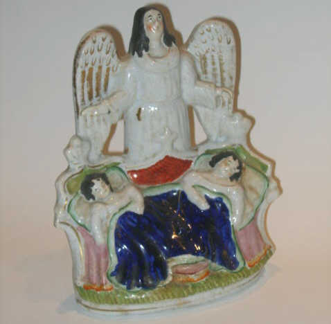 Appraisal: STAFFORDSHIRE ENGLAND Figure group of an angel overlooking two sleeping