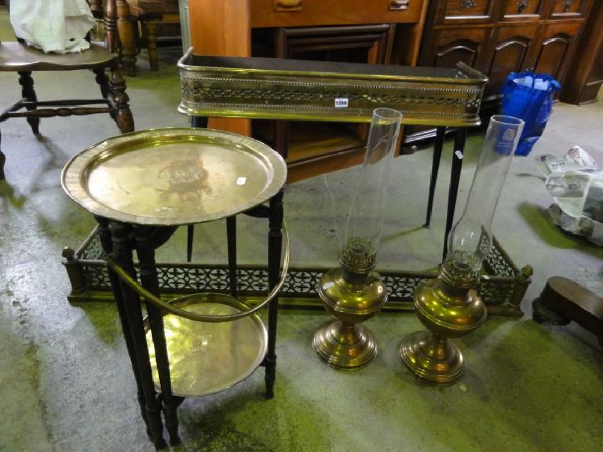 Appraisal: Two pierced brass fenders of varying design together with a