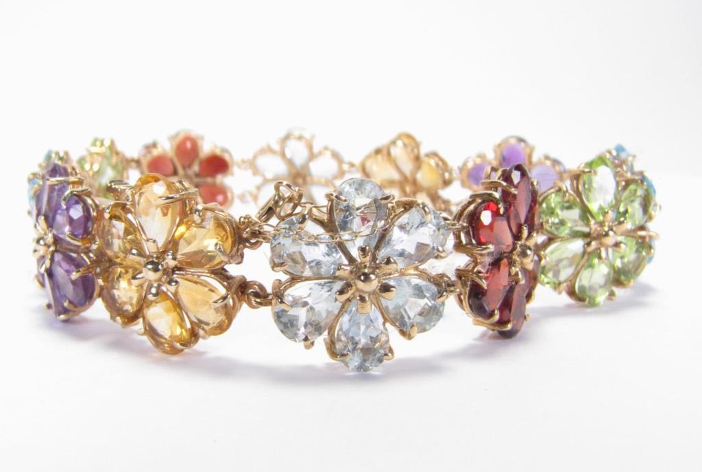 Appraisal: A K yellow gold Colored Stone flower link bracelet with