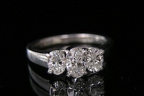 Appraisal: Three-Stone Diamond Ring Marked platinum setting with three prong-set oval-cut